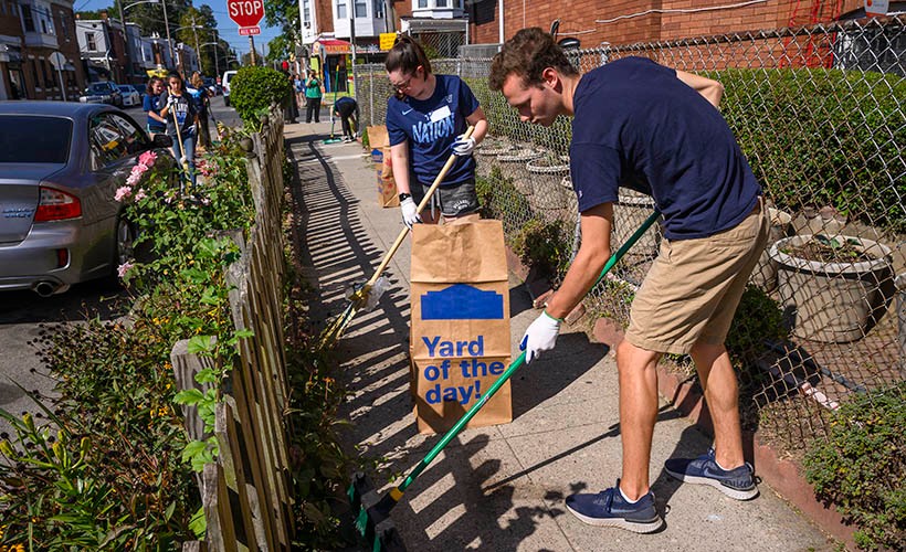 Students raking for volunteer work