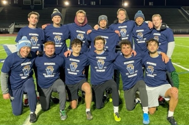 Male students posing for soccer champion photo