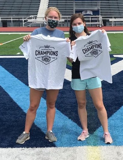 Two female students posing for bocce ball champs photo