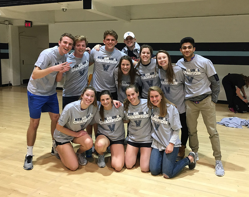 Students posing for indoor volleyball champion photo
