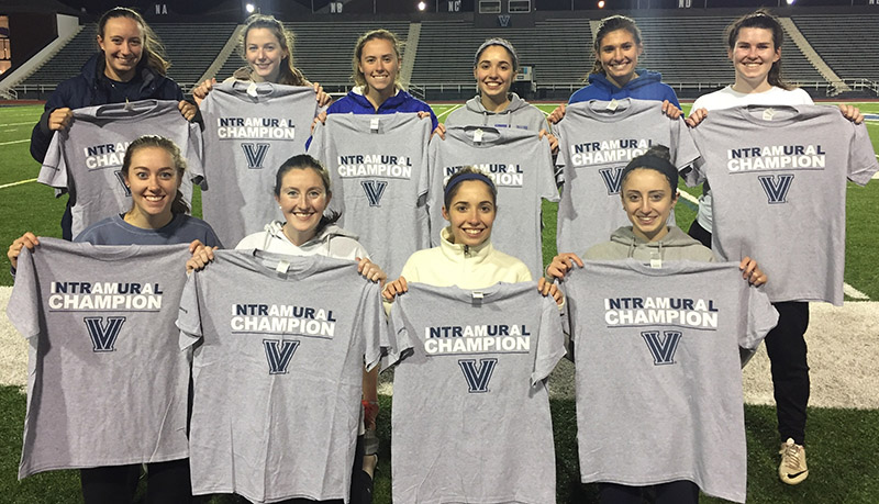 Female students posing for soccer champion photo