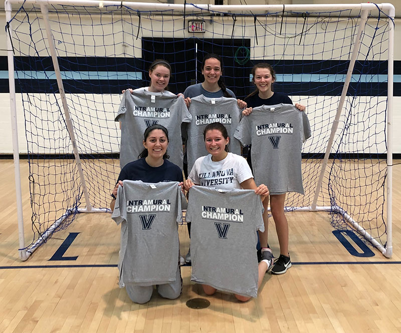 Female students posing for handball photo