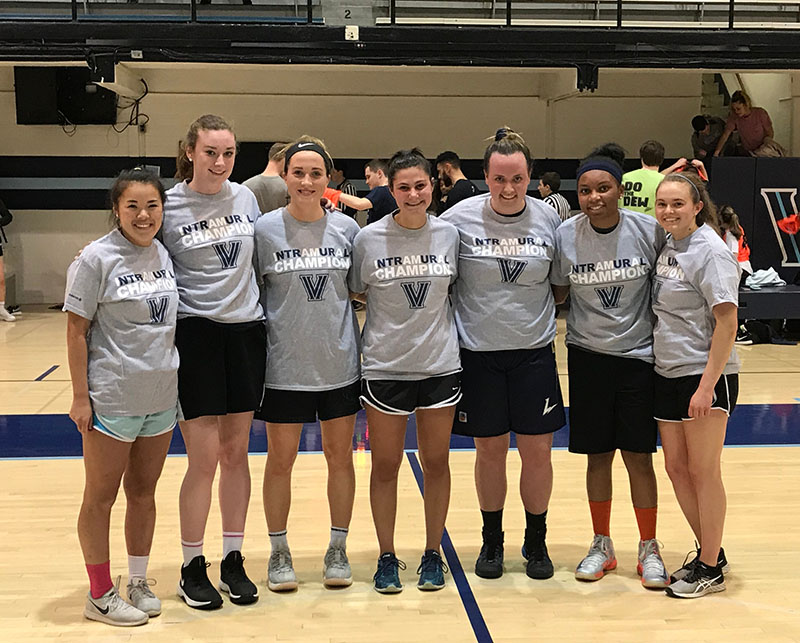 Female students posing for basketball champion photo