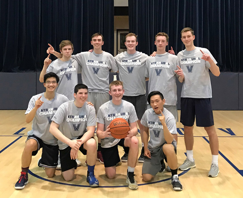 Male students posing for basketball champion photo