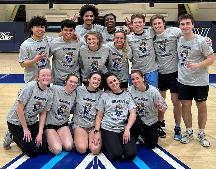 Students posing for basketball champion photo