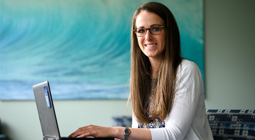 Classical Studies master's student joining class on her laptop.