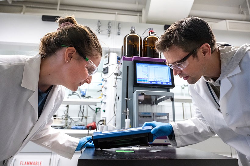 Professor and student working in lab