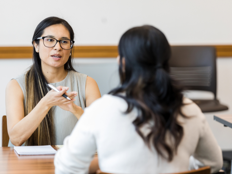 manager and employee engaged in a performance review conversation