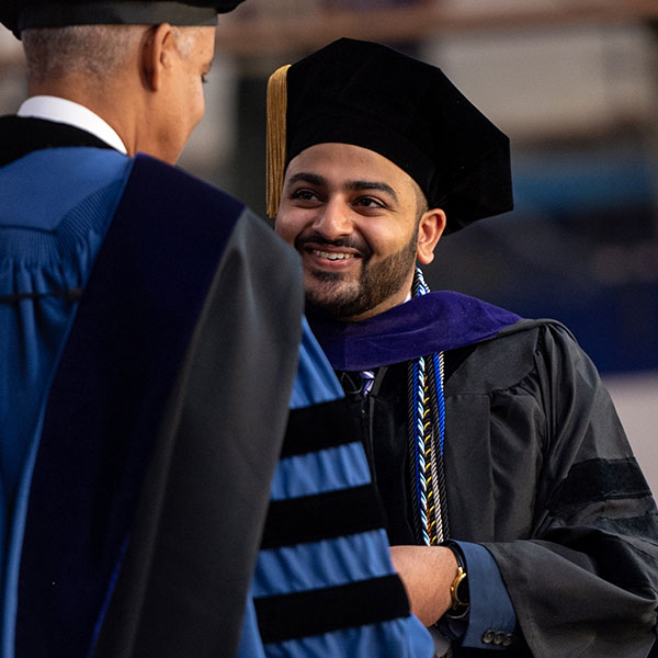 a Villanova Law graduate in his cap and gown