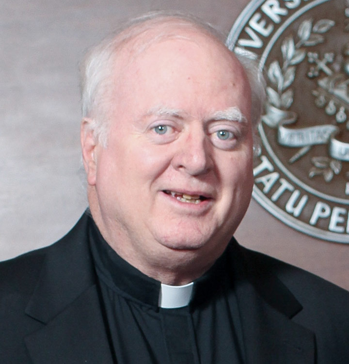 a headshot of the Rev. John P. Stack